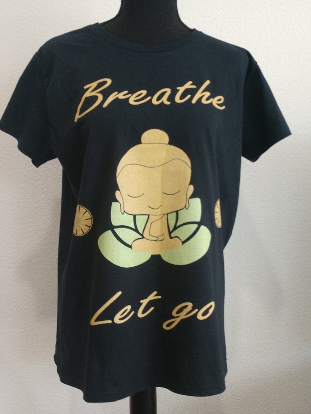 Anvil Black Short Sleeve Tee with Gold and Pale Green Meditating Graphic